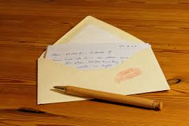 This is a picture of an open envelope containing a letter and a kiss stain.  